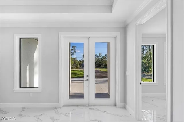 a kitchen with a refrigerator and a stove