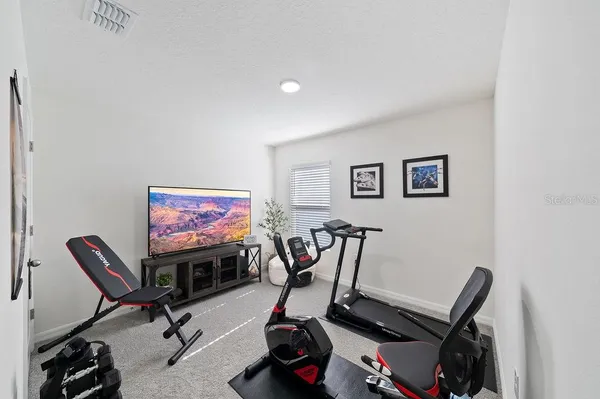 a view of a workspace with furniture