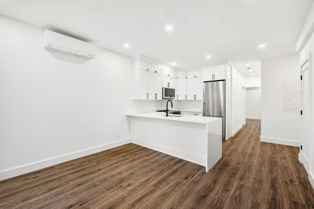 a view of kitchen with wooden floor
