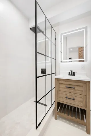 a bathroom with a sink and a mirror