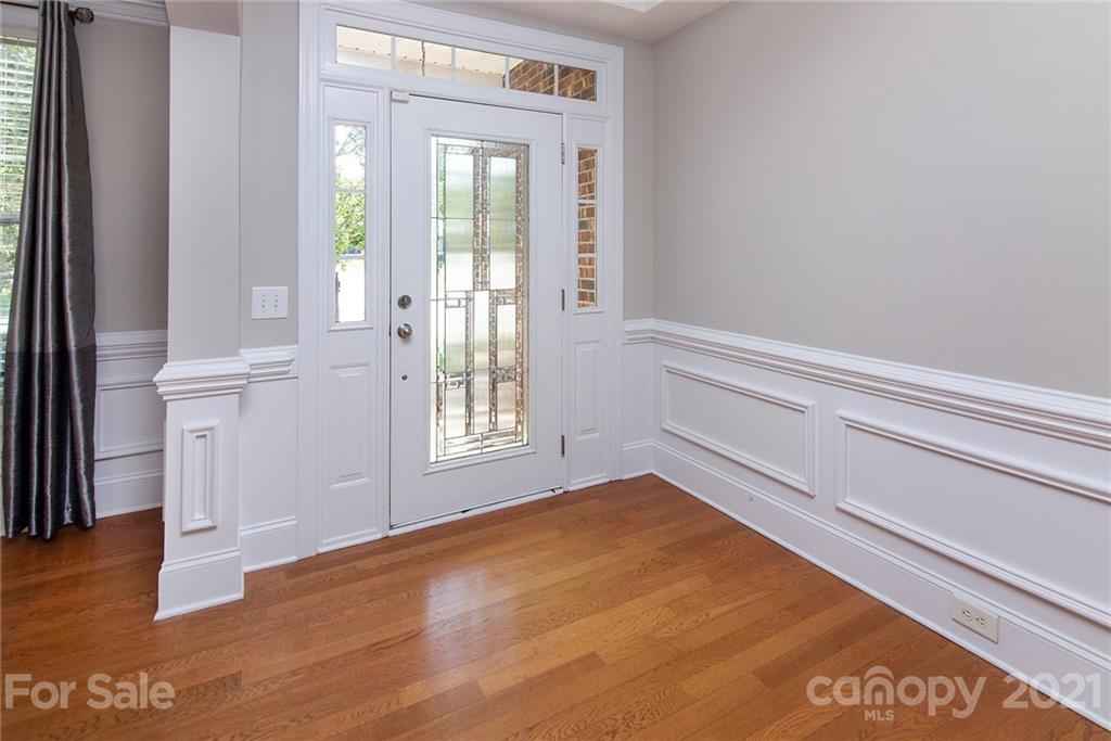 10617 Round Rock Road Charlotte, NC 28277 - Photo 12 of 28 a view of empty room with wooden floor and fan