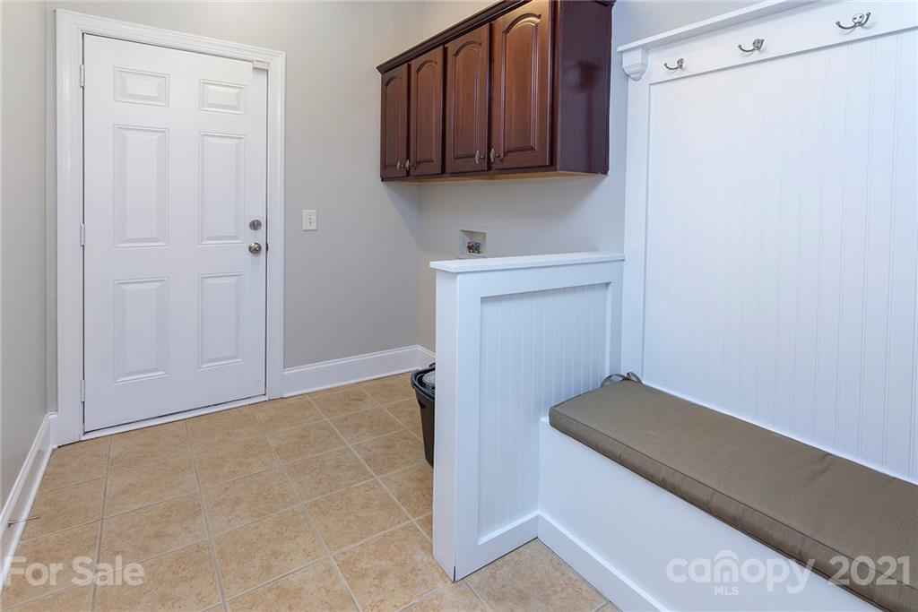 10617 Round Rock Road Charlotte, NC 28277 - Photo 18 of 28 a view of a kitchen with dishwasher and white cabinets