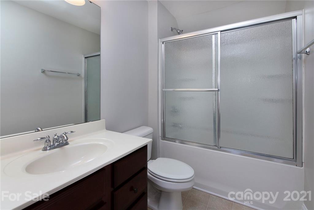 10617 Round Rock Road Charlotte, NC 28277 - Photo 24 of 28 a bathroom with a sink toilet and shower