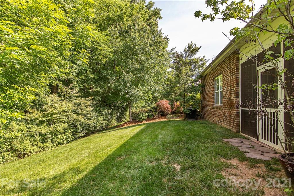 10617 Round Rock Road Charlotte, NC 28277 - Photo 26 of 28 a backyard of a house with lots of green space