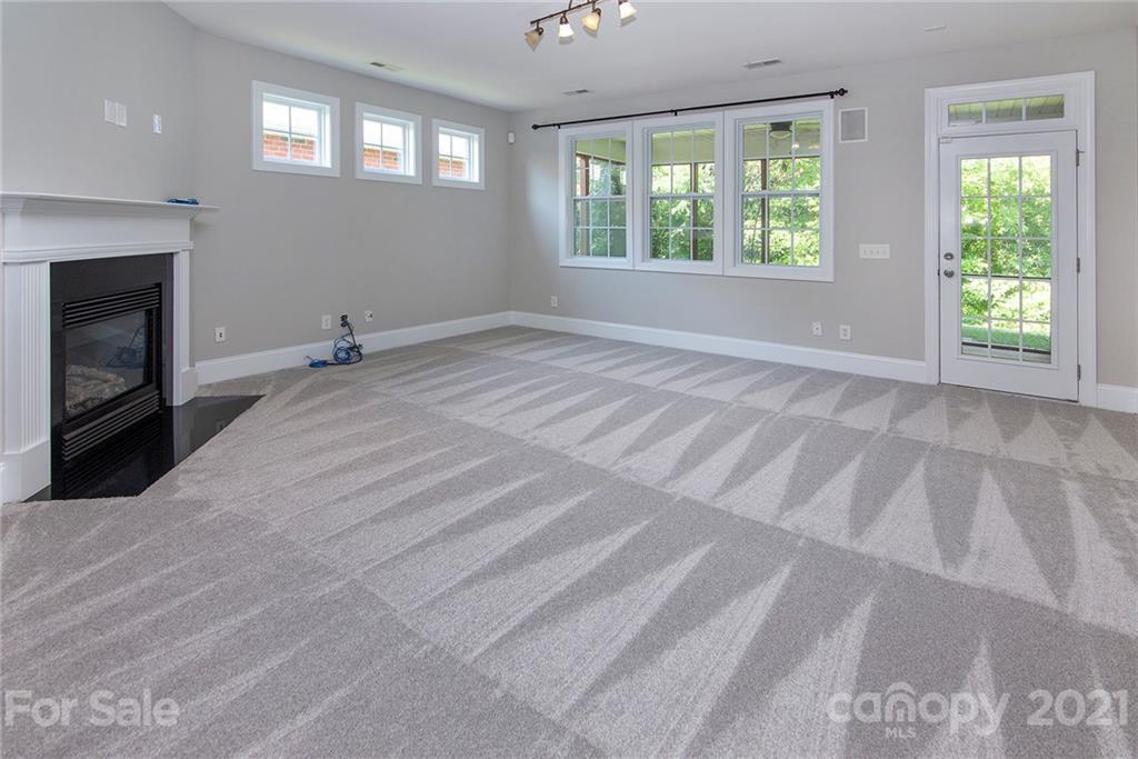 10617 Round Rock Road Charlotte, NC 28277 - Photo 9 of 28 a view of empty room with window and fireplace