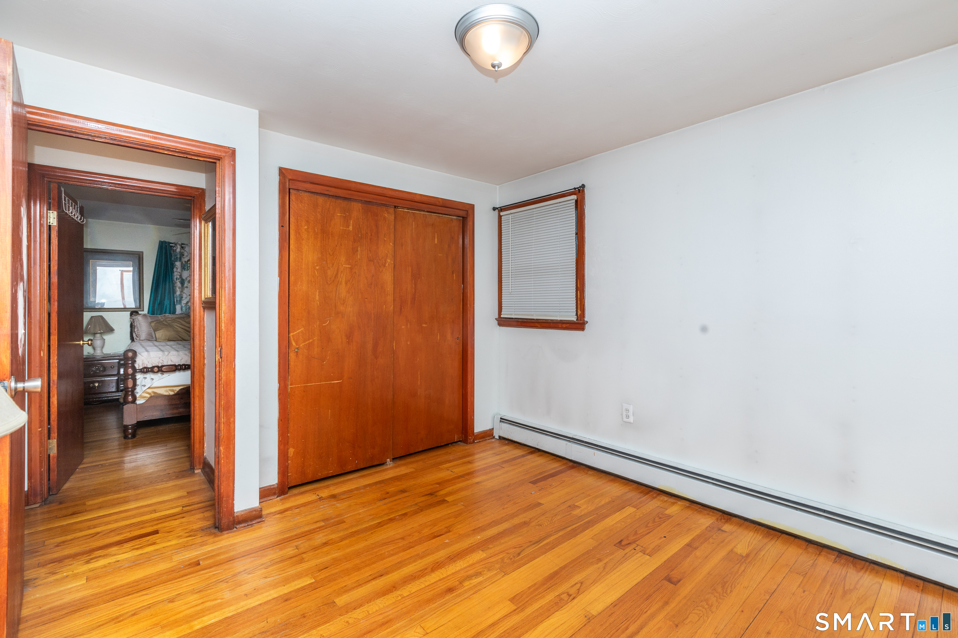 97 Benson Street New Britain, CT 06051 - Photo 13 of 24 a view of empty room with wooden floor