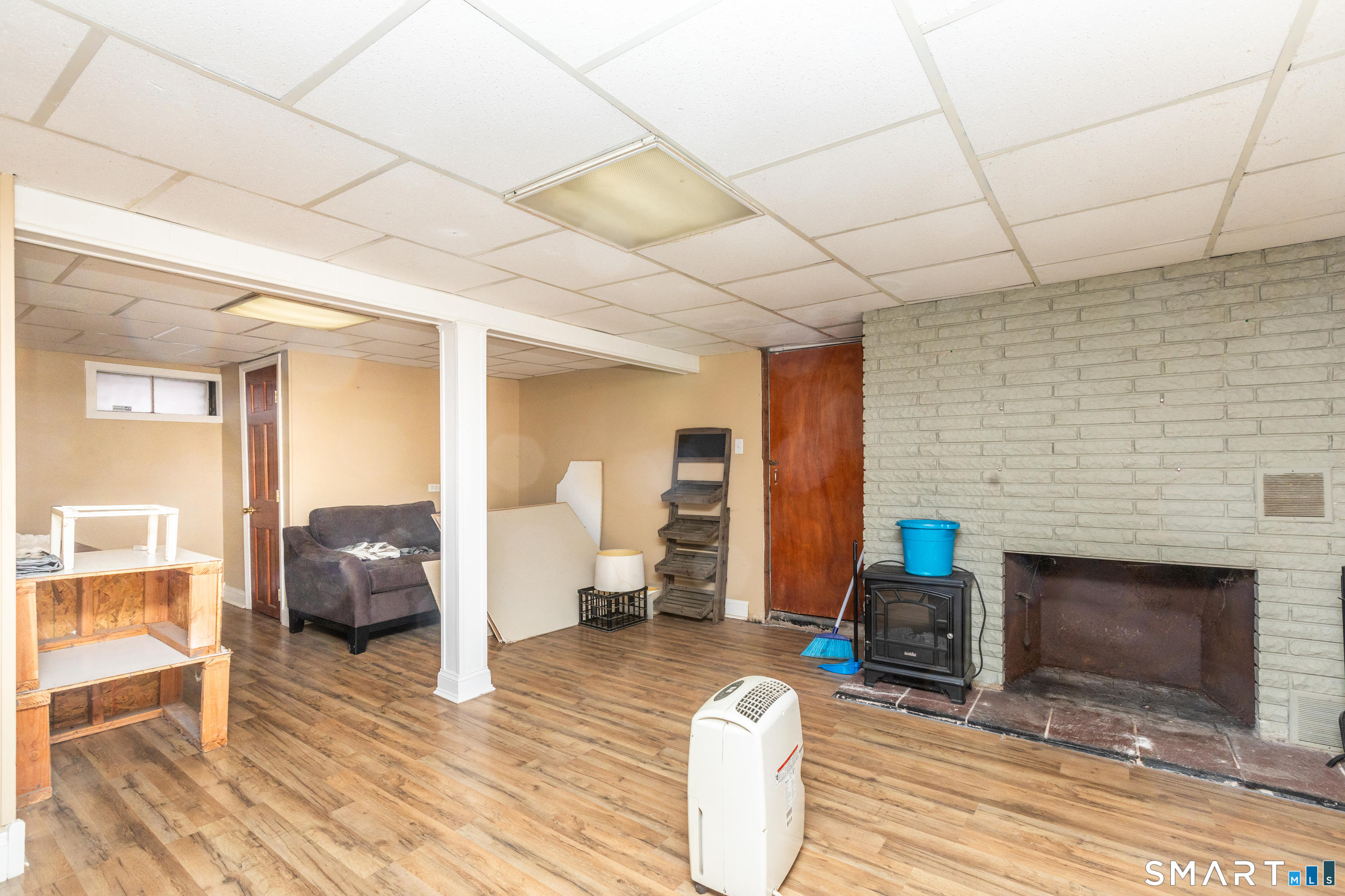 97 Benson Street New Britain, CT 06051 - Photo 16 of 24 a bedroom with furniture and a fireplace