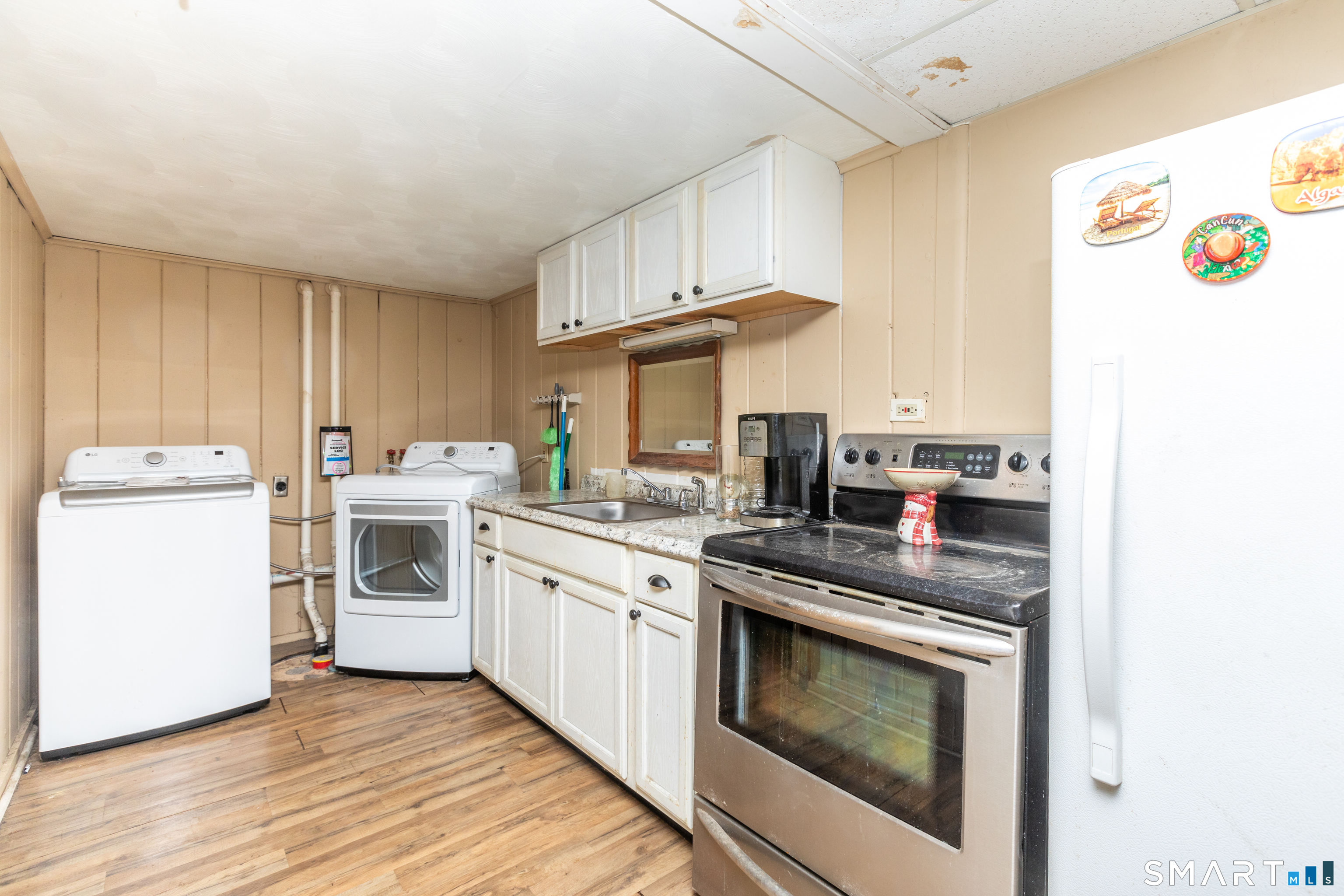 97 Benson Street New Britain, CT 06051 - Photo 18 of 24 a kitchen with a stove top oven sink and cabinets