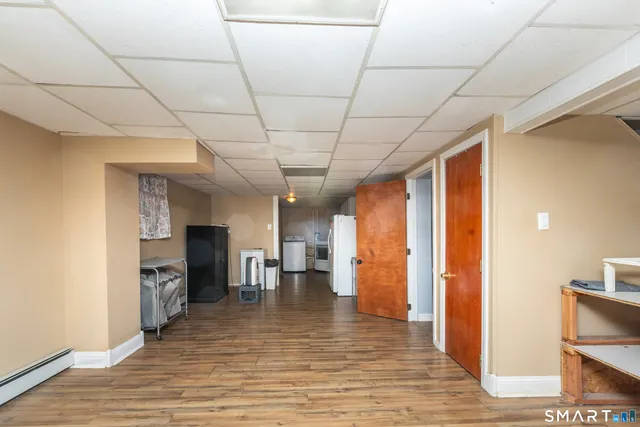 a view of a livingroom with furniture and a kitchen