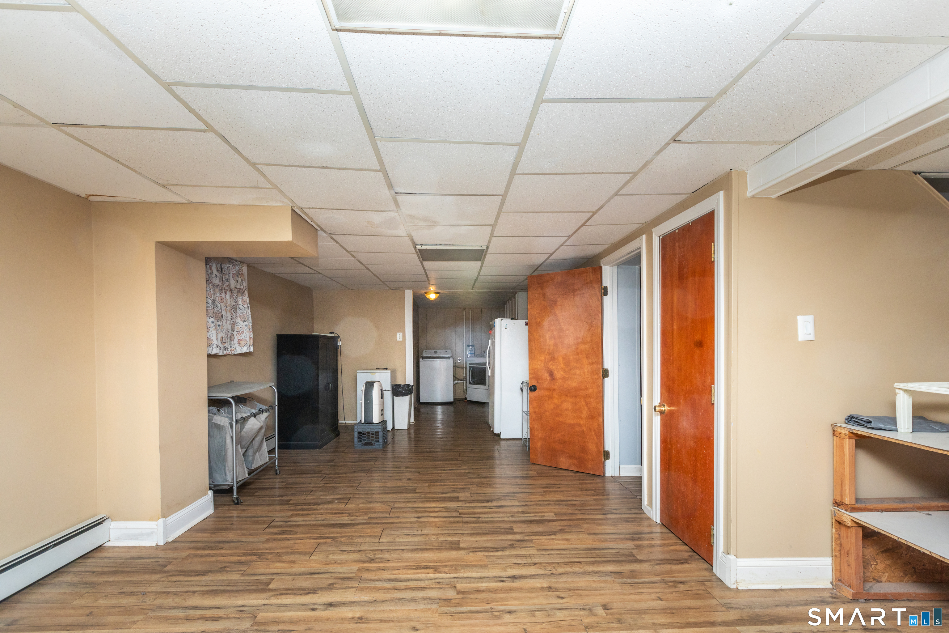 97 Benson Street New Britain, CT 06051 - Photo 20 of 24 a view of a livingroom with furniture and a kitchen