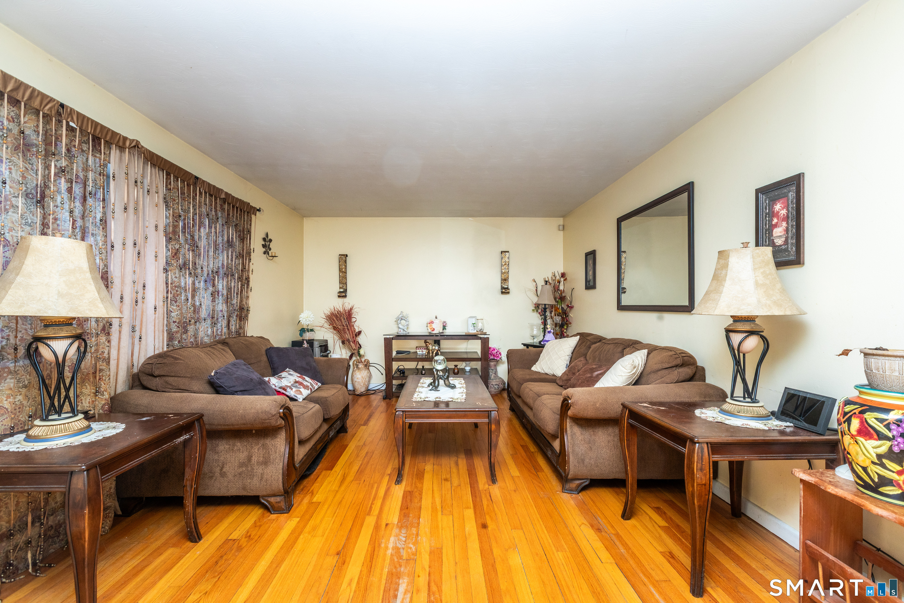 97 Benson Street New Britain, CT 06051 - Photo 2 of 24 a living room with furniture and a wooden floor