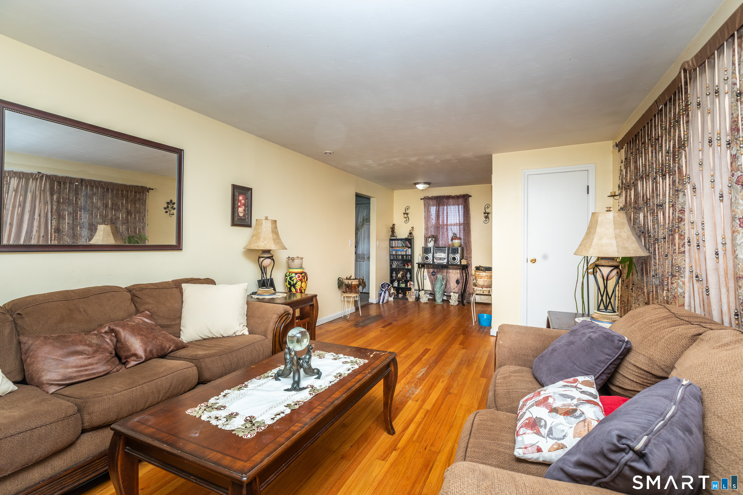 97 Benson Street New Britain, CT 06051 - Photo 6 of 24 a living room with furniture and a table