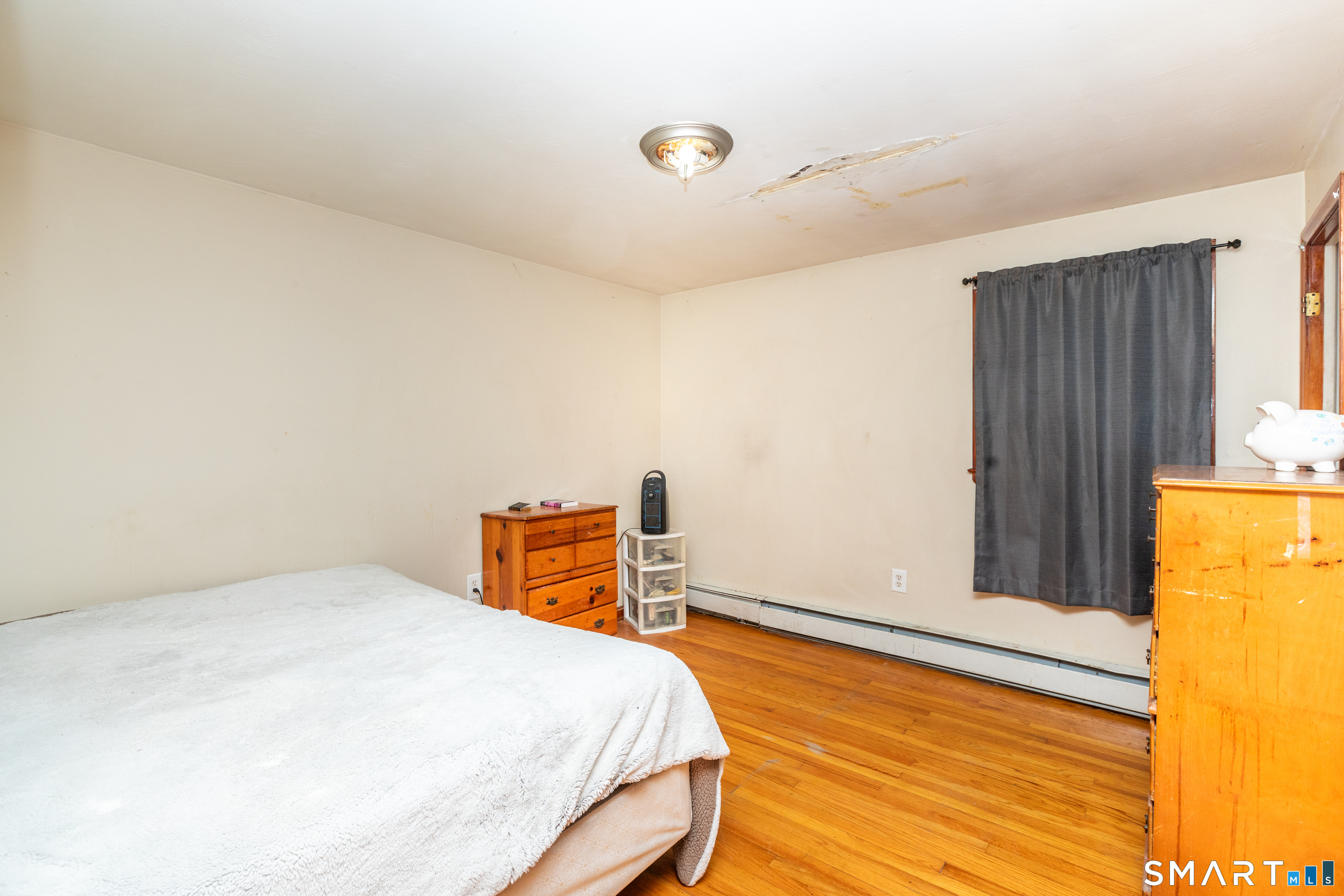 97 Benson Street New Britain, CT 06051 - Photo 9 of 24 a bedroom with a bed and a window