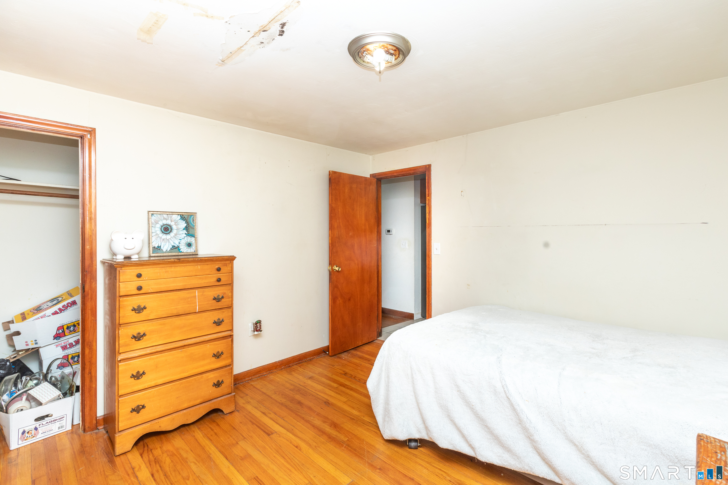 97 Benson Street New Britain, CT 06051 - Photo 10 of 24 a bedroom with a bed and a dresser