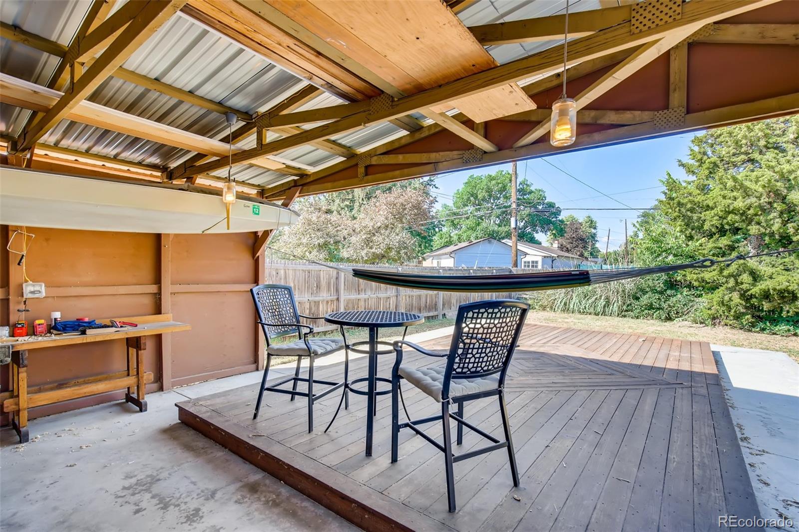 4611 Pierce Street Wheat Ridge, CO 80033 - Photo 25 of 30 a view of a chairs and table in the patio