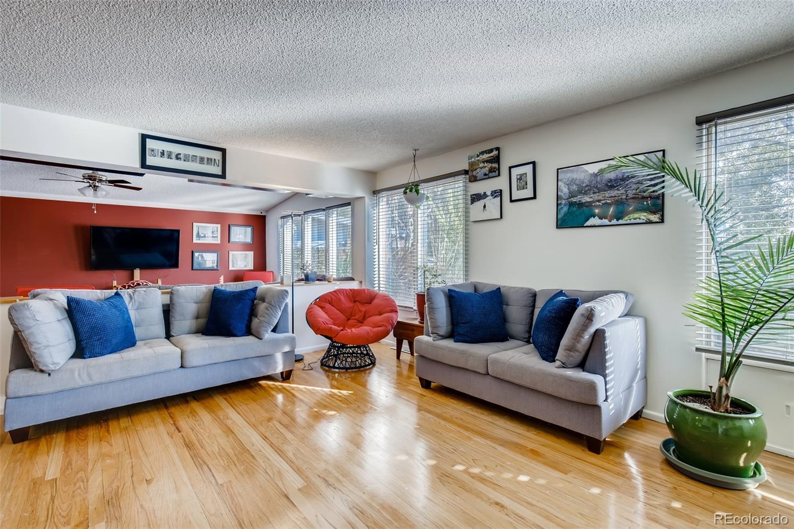 4611 Pierce Street Wheat Ridge, CO 80033 - Photo 7 of 30 a living room with furniture and a couch