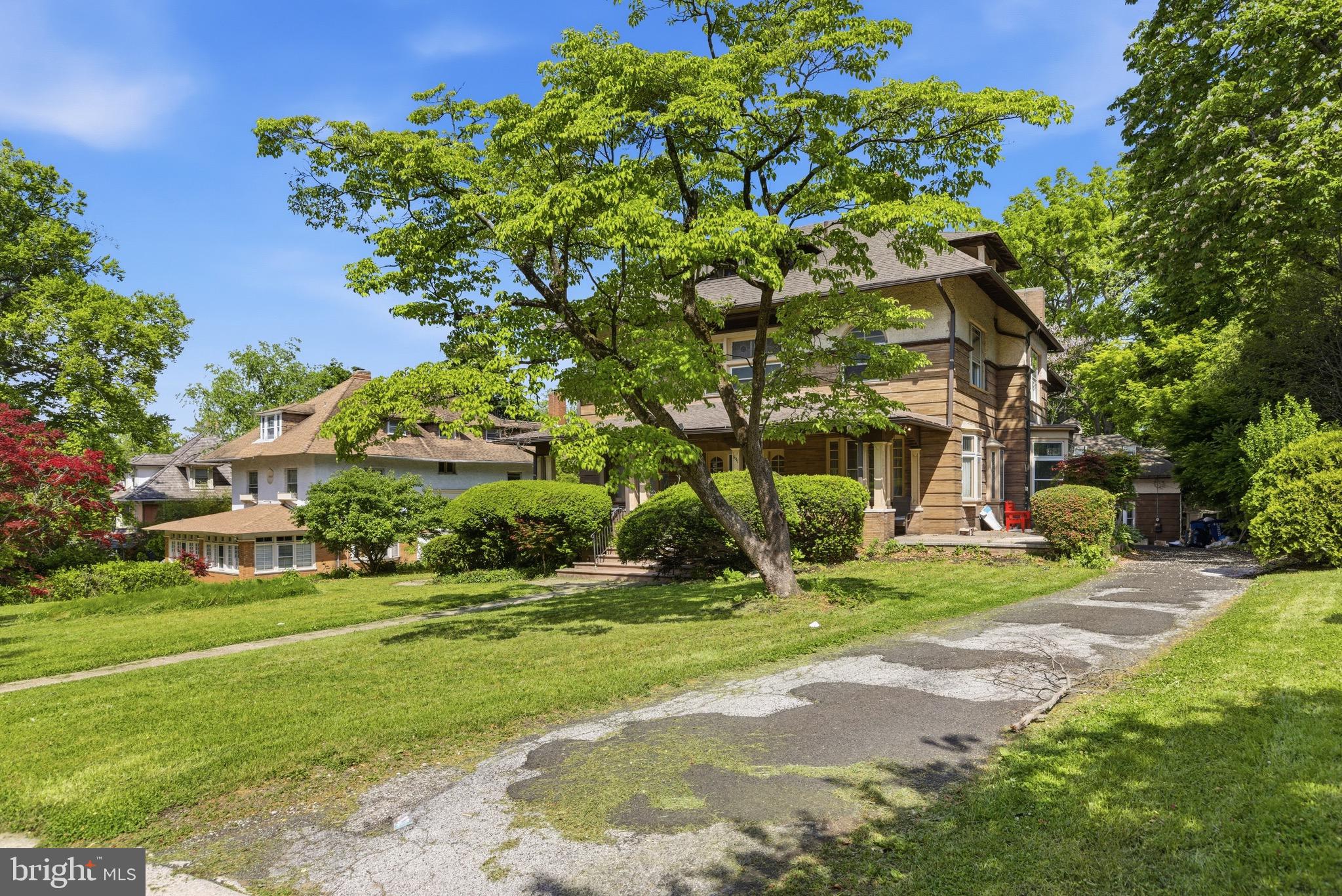5939 Drexel Road, Unit 2 Philadelphia, PA 19131 - Photo 16 of 17 a view of a house with a tree and garden