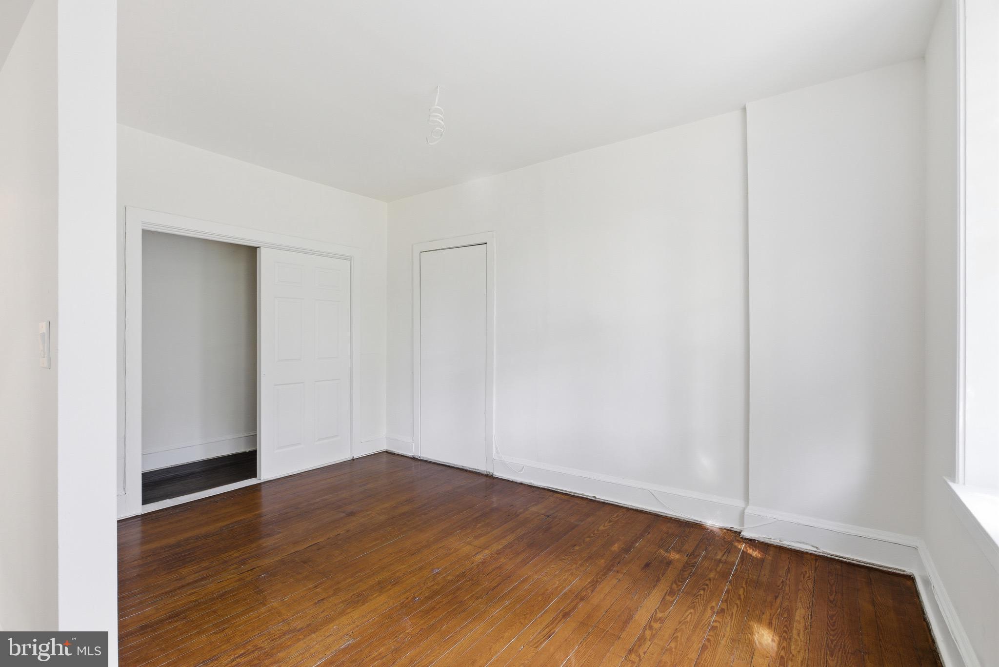 5939 Drexel Road, Unit 2 Philadelphia, PA 19131 - Photo 4 of 17 a view of an empty room with wooden floor