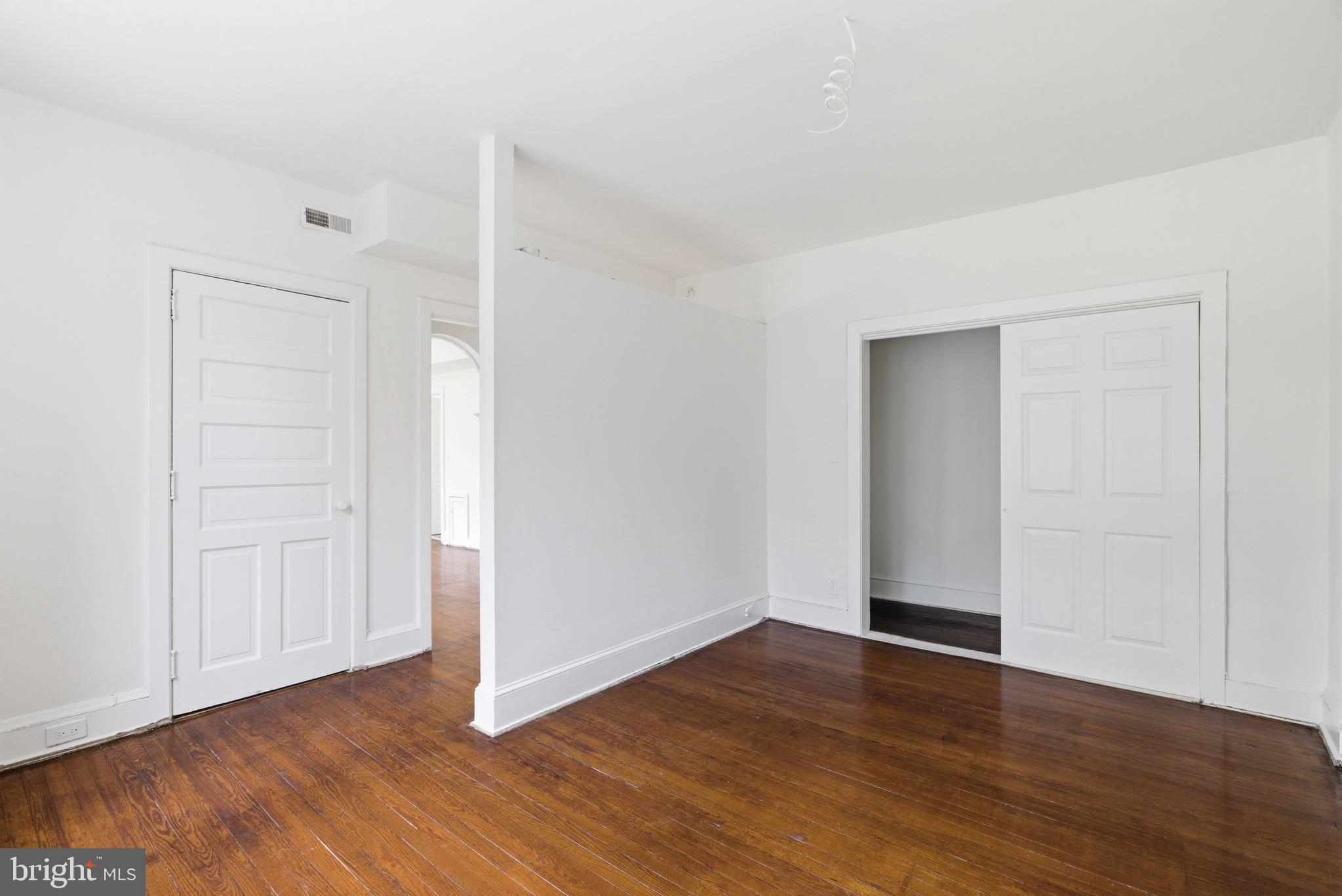 5939 Drexel Road, Unit 2 Philadelphia, PA 19131 - Photo 5 of 17 a view of an empty room with wooden floor