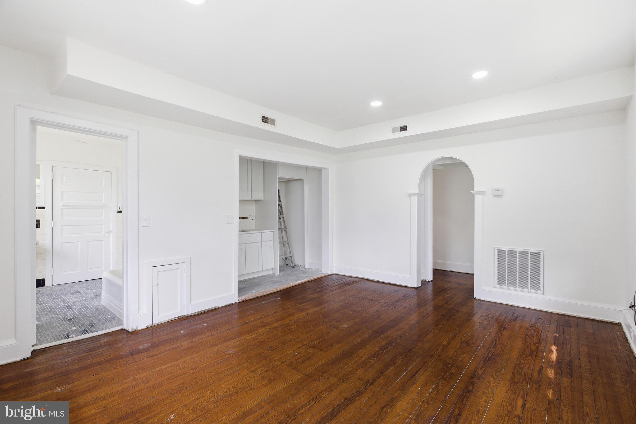 5939 Drexel Road, Unit 2 Philadelphia, PA 19131 - Photo 8 of 17 wooden floor in an empty room with a window