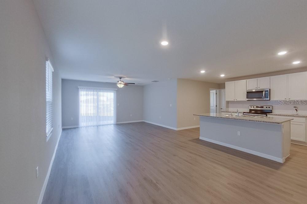 4397 Southwest 85th Lane Ocala, FL 34476 - Photo 2 of 23 a view of kitchen with wooden floor and electronic appliances
