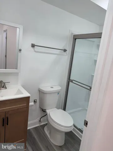 a white toilet sitting next to a bathroom sink