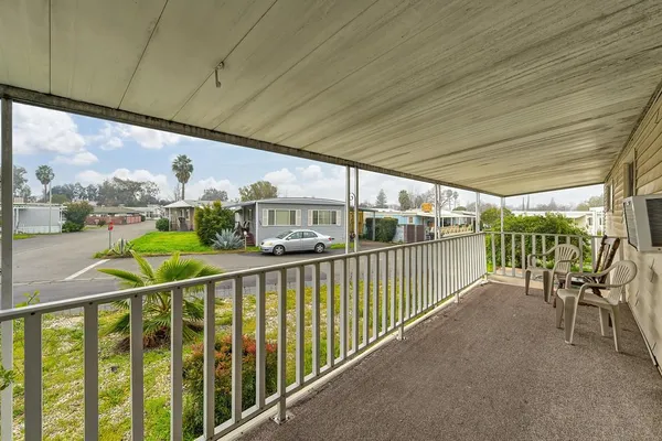 a view of balcony with furniture