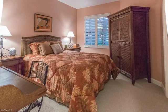 a bedroom with bed and window