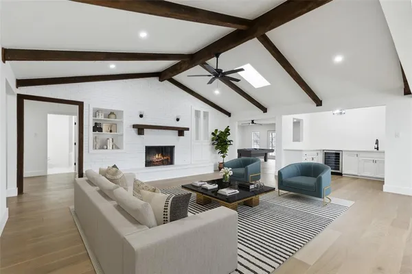 a living room with furniture fireplace and a flat screen tv