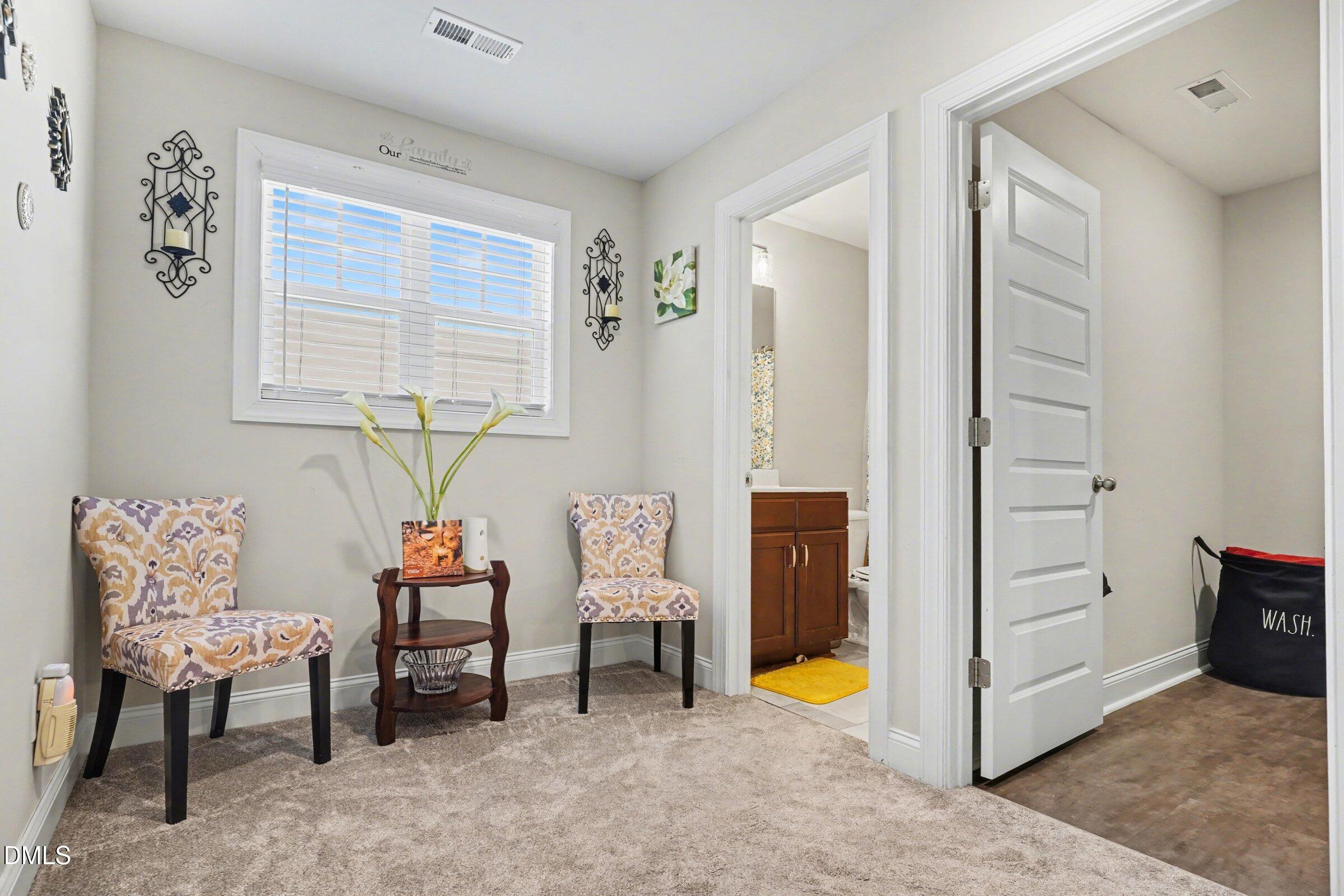 10 Mitchell Rdg Drive Youngsville, NC 27596 - Photo 19 of 38 a room that has a bed and a chair