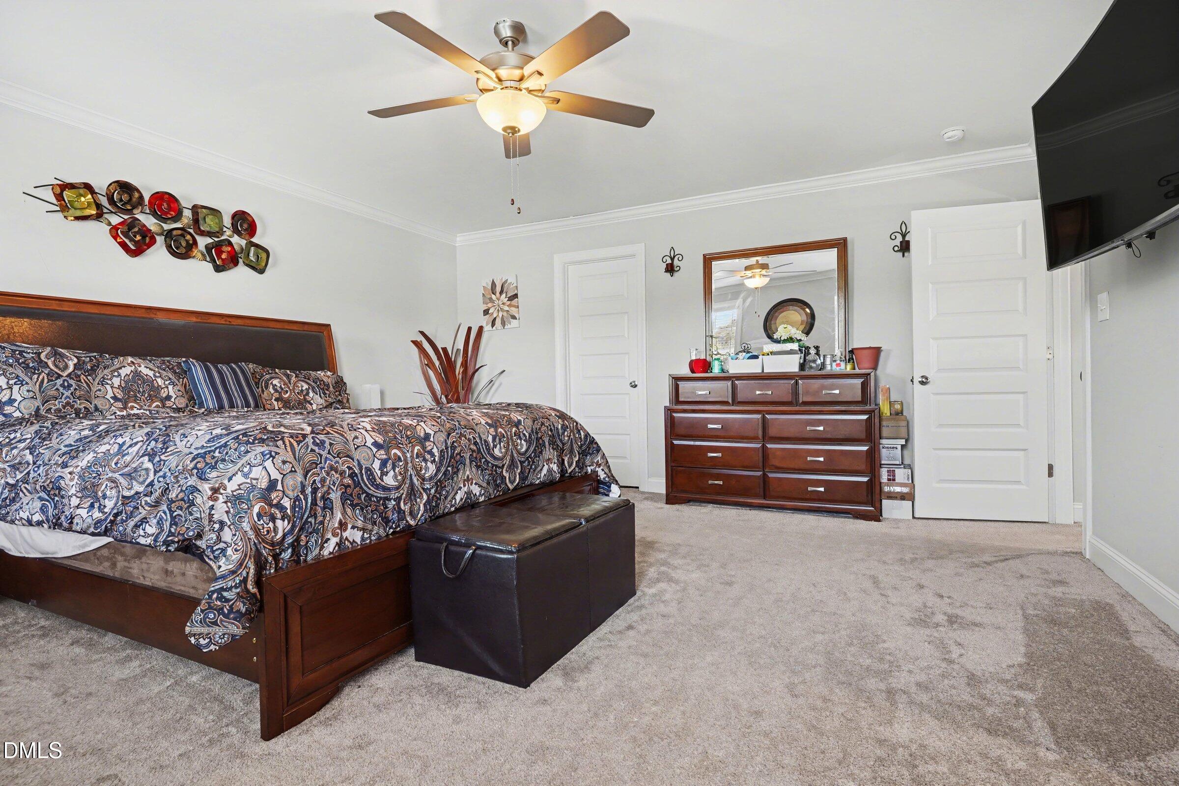 10 Mitchell Rdg Drive Youngsville, NC 27596 - Photo 23 of 38 a living room with furniture and a flat screen tv