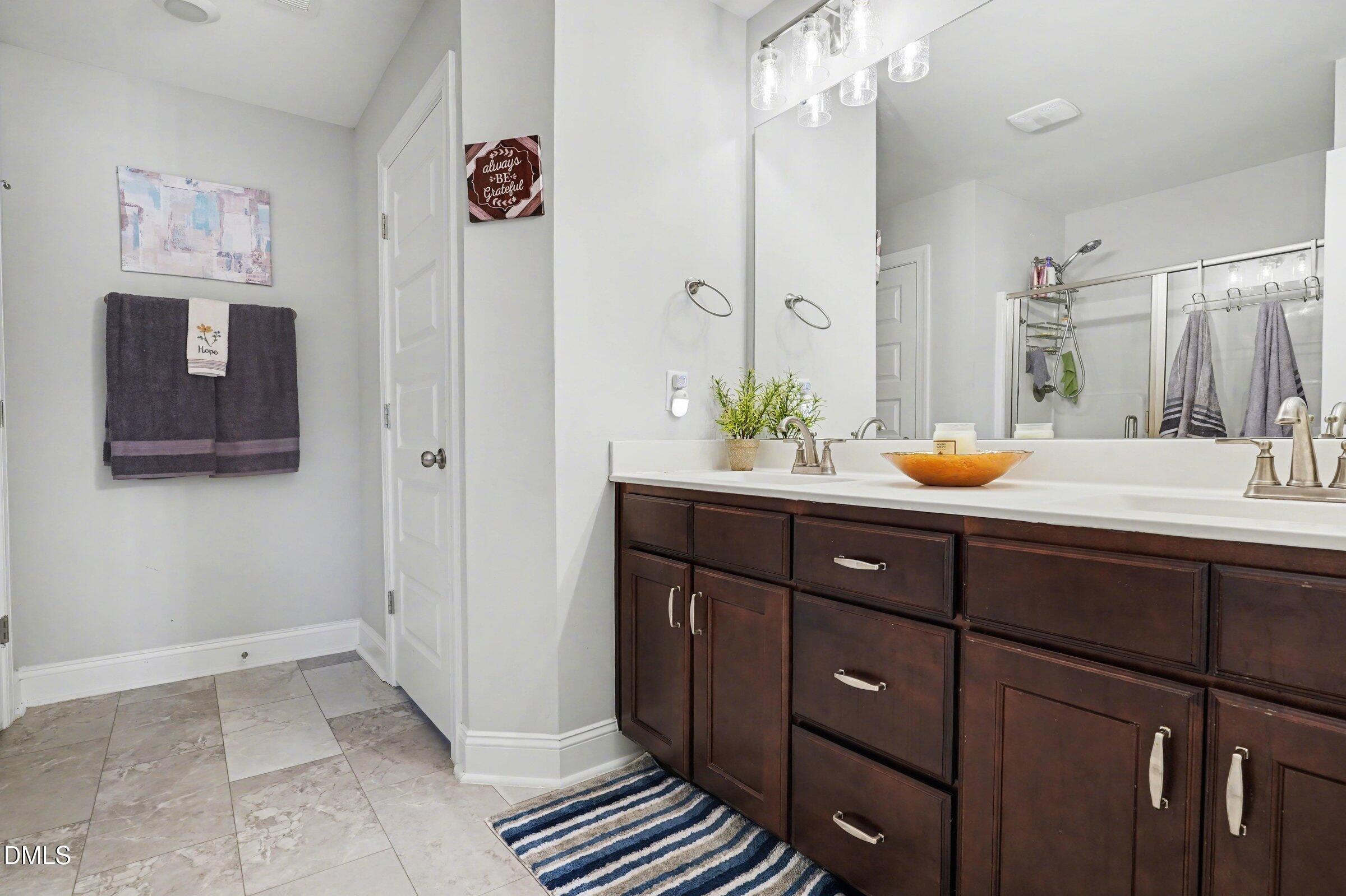 10 Mitchell Rdg Drive Youngsville, NC 27596 - Photo 25 of 38 a bathroom with a sink and a mirror