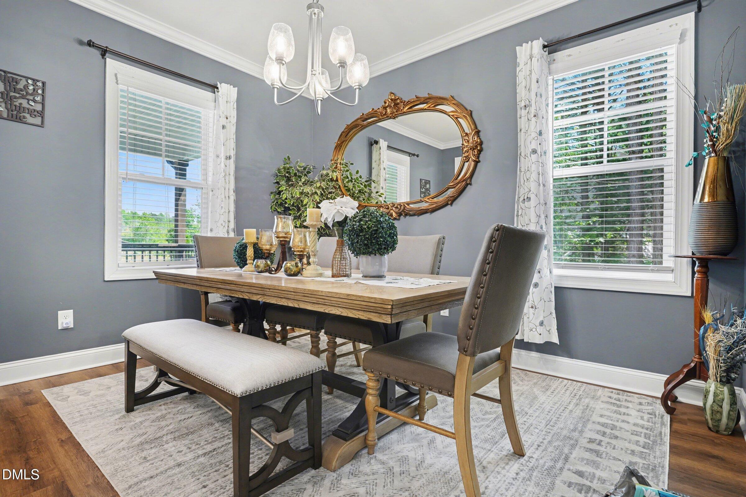 10 Mitchell Rdg Drive Youngsville, NC 27596 - Photo 8 of 38 a view of a dining room with furniture a chandelier and a window