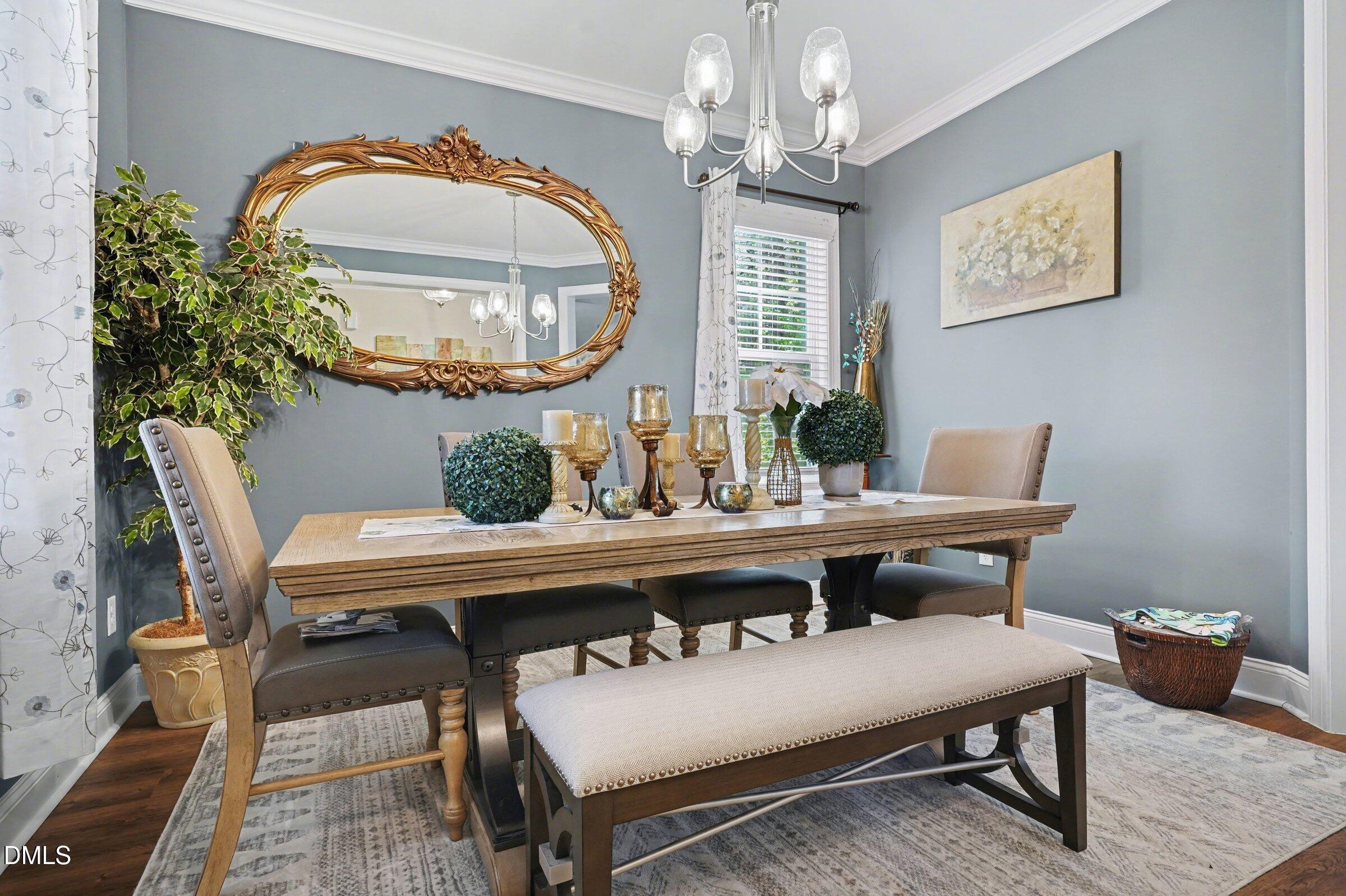 10 Mitchell Rdg Drive Youngsville, NC 27596 - Photo 9 of 38 a view of a dining room with furniture and chandelier
