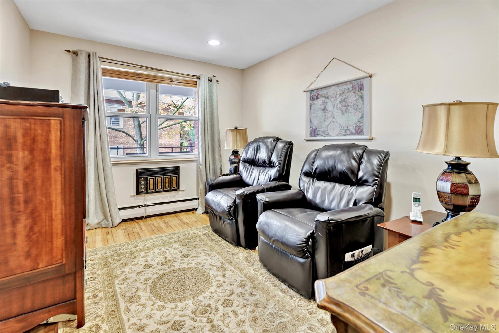 200 South Middle Neck Road, Unit J6 Great Neck, NY 11021 - Photo 11 of 22 a living room with furniture window and a fireplace