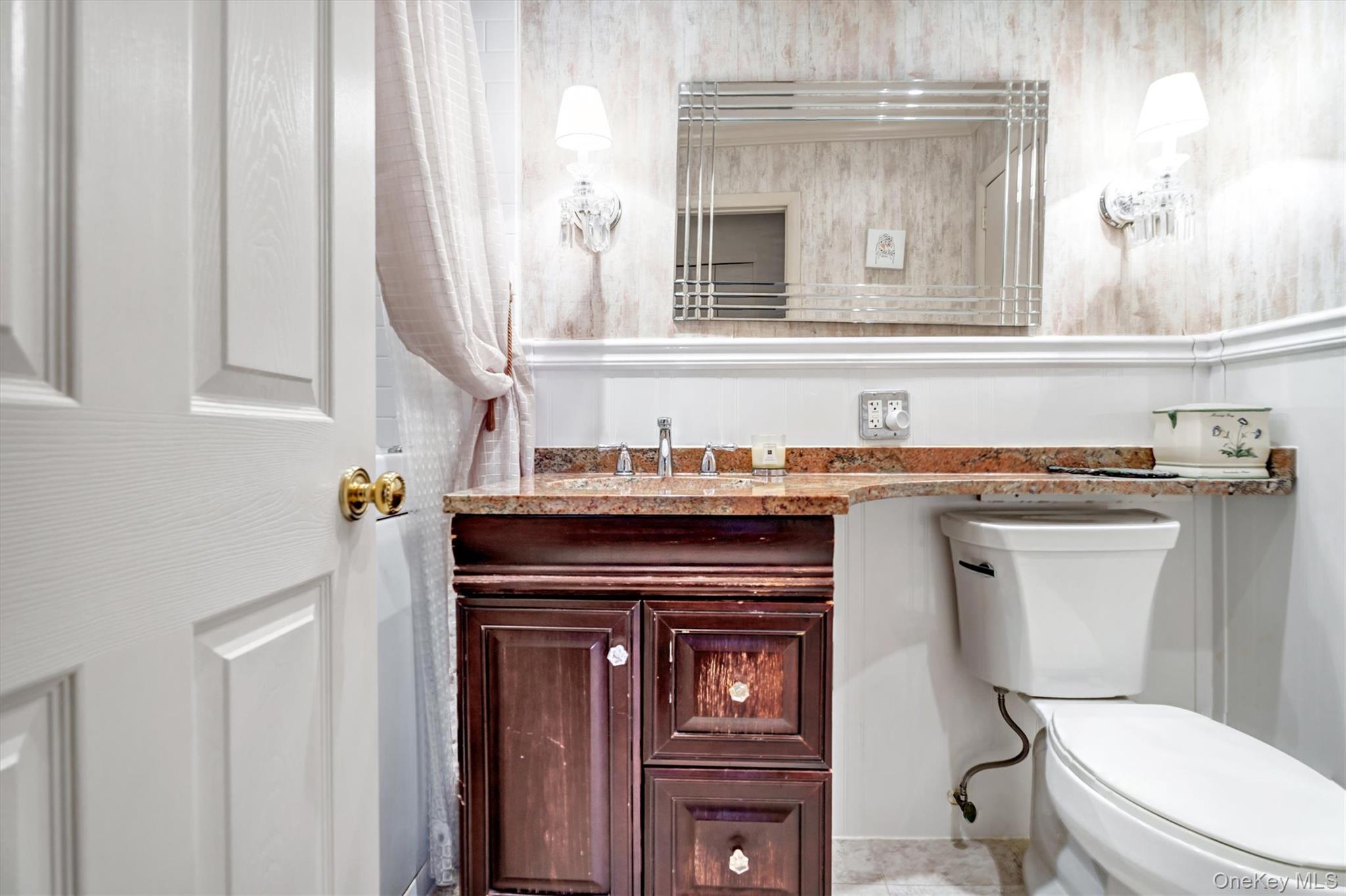 200 South Middle Neck Road, Unit J6 Great Neck, NY 11021 - Photo 15 of 22 a view of a bathroom with a sink and a toilet
