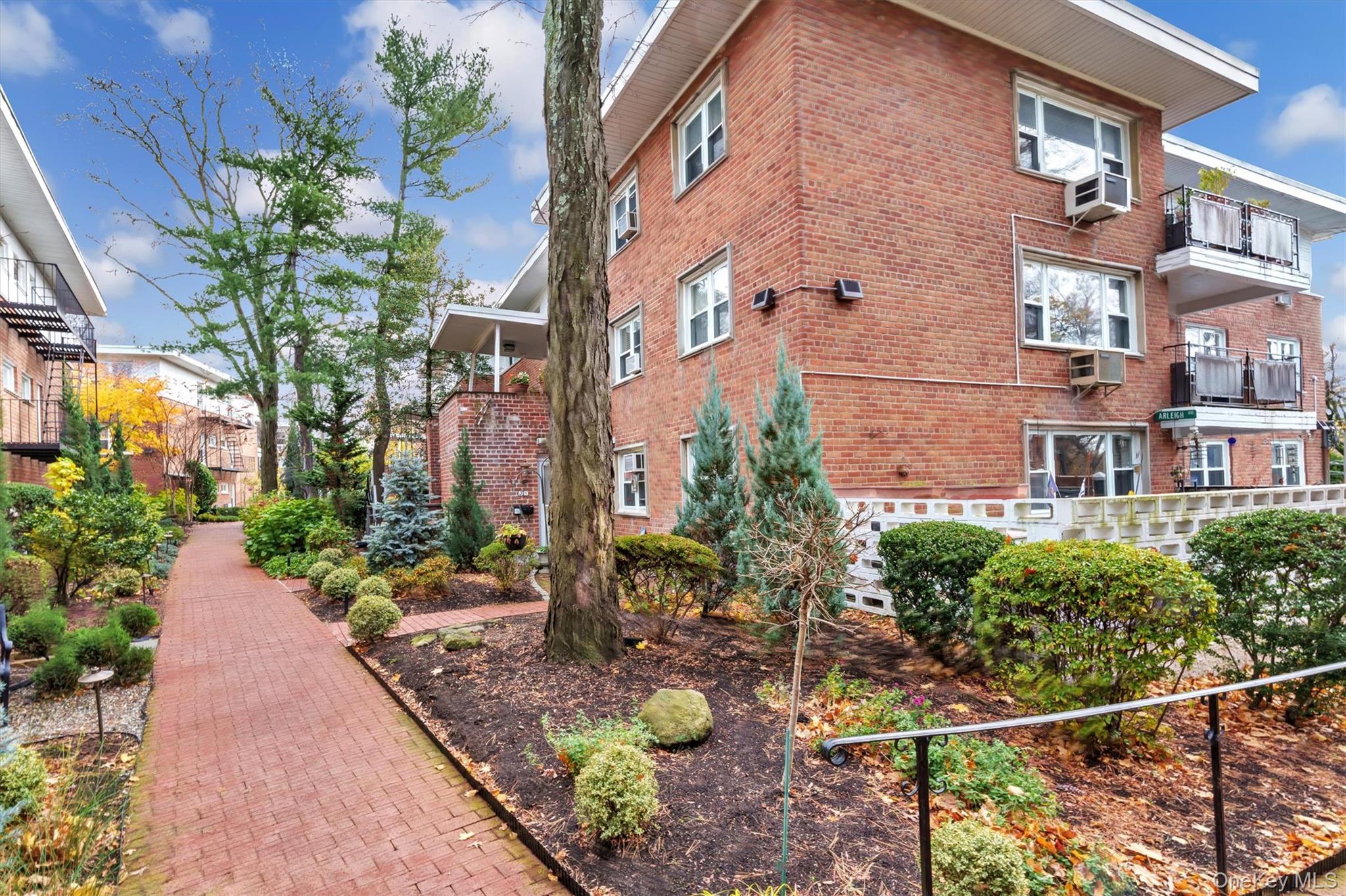 200 South Middle Neck Road, Unit J6 Great Neck, NY 11021 - Photo 3 of 22 a view of a garden with brick walls