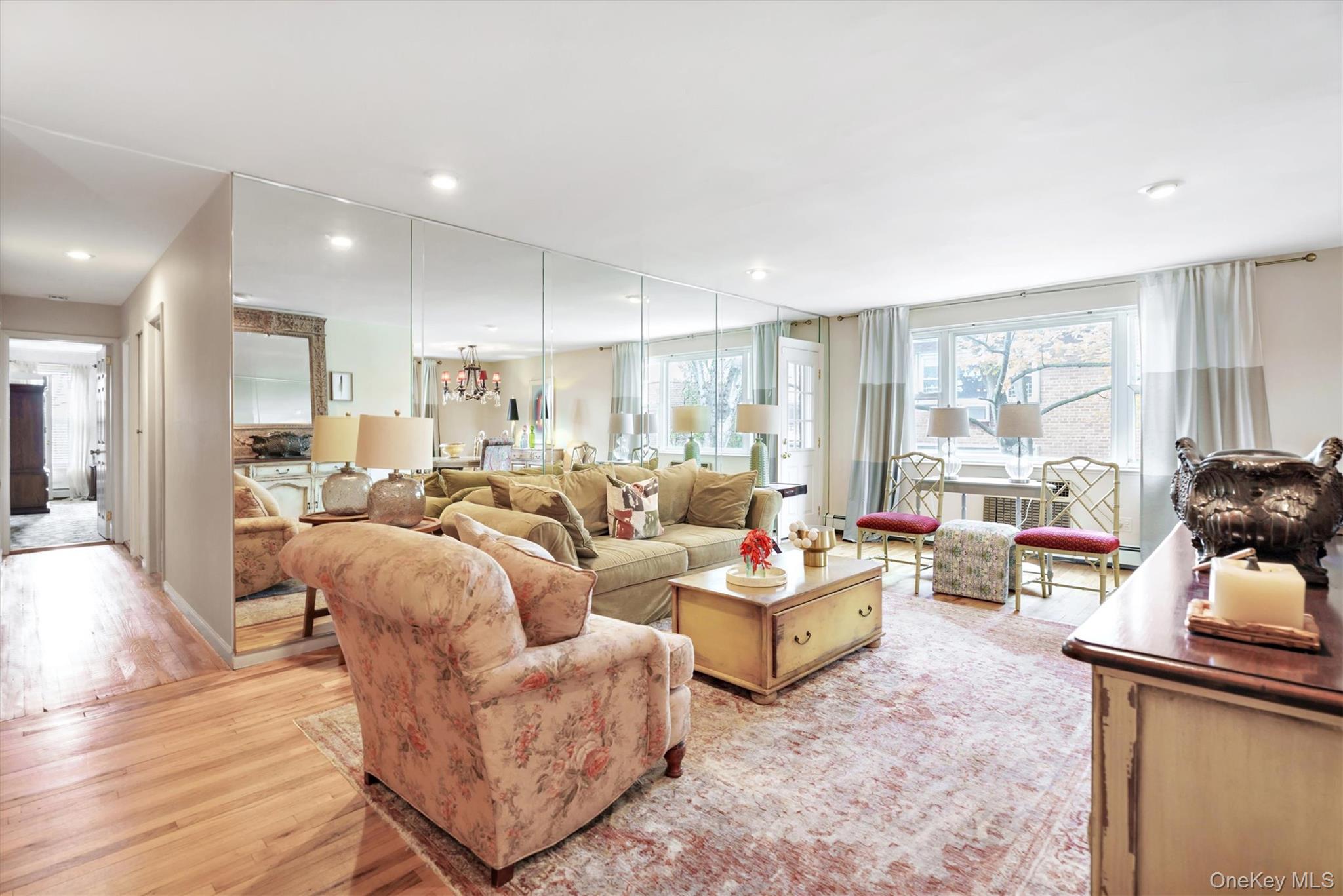 200 South Middle Neck Road, Unit J6 Great Neck, NY 11021 - Photo 4 of 22 a living room with furniture and a large window