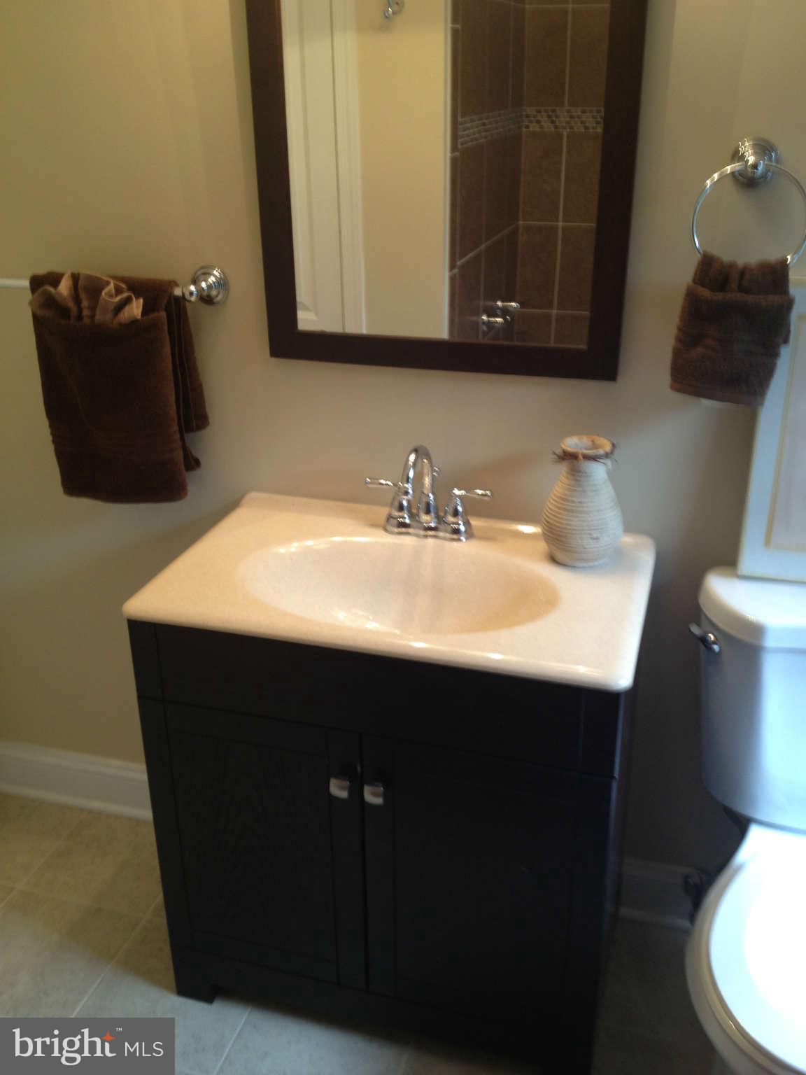 4639 Marble Hall Road Baltimore, MD 21239 - Photo 14 of 30 a bathroom with a sink and a mirror