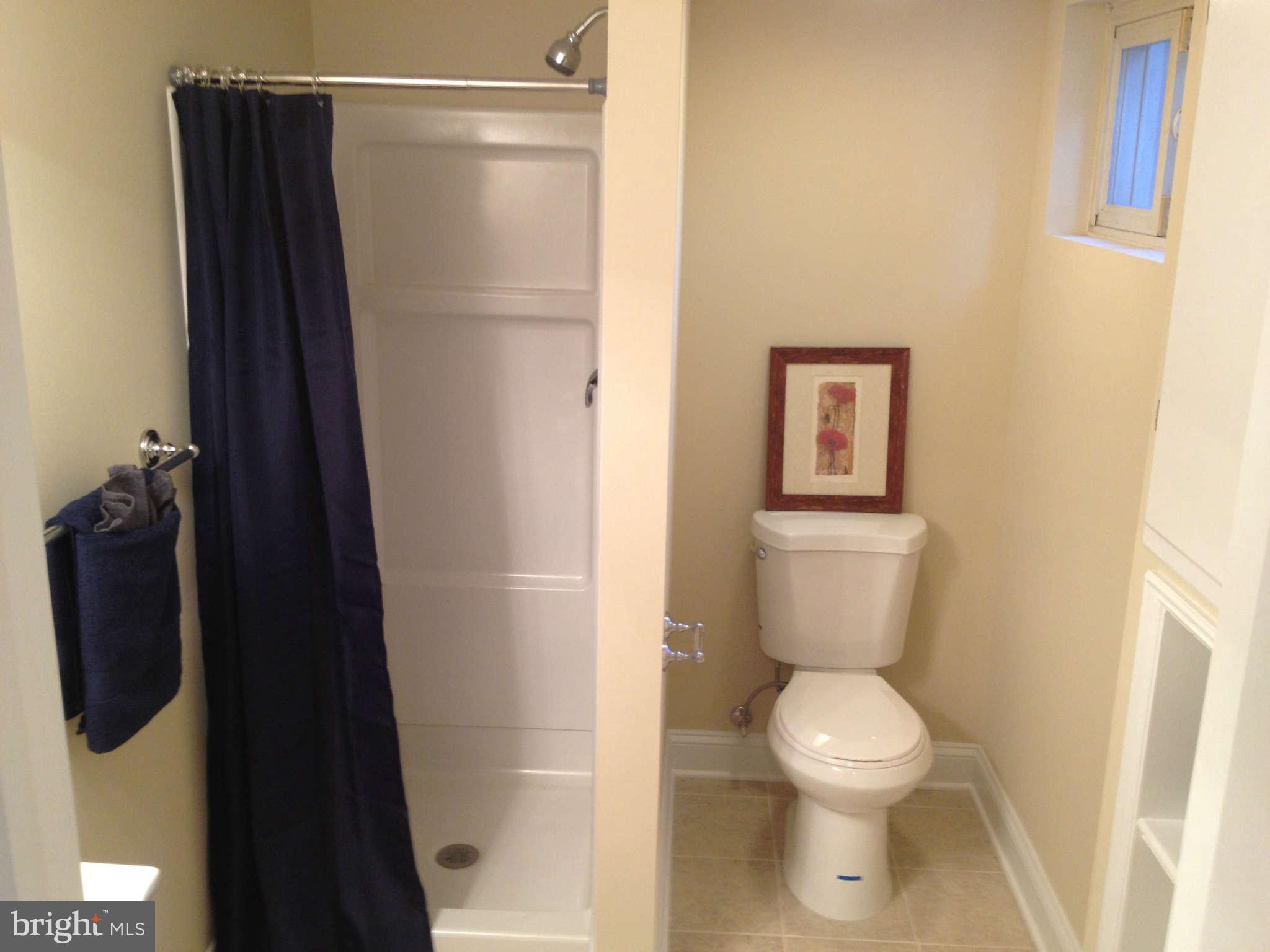 4639 Marble Hall Road Baltimore, MD 21239 - Photo 8 of 30 a bathroom with a toilet and a shower