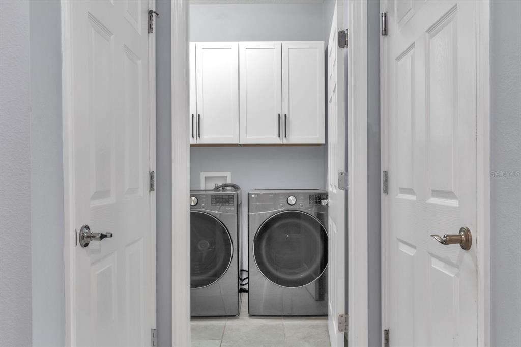 12653 Palapa Loop Spring Hill, FL 34610 - Photo 19 of 33 a view of a hallway with washer and dryer