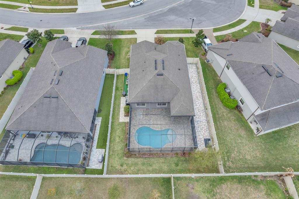 12653 Palapa Loop Spring Hill, FL 34610 - Photo 3 of 33 an aerial view of a house with a swimming pool