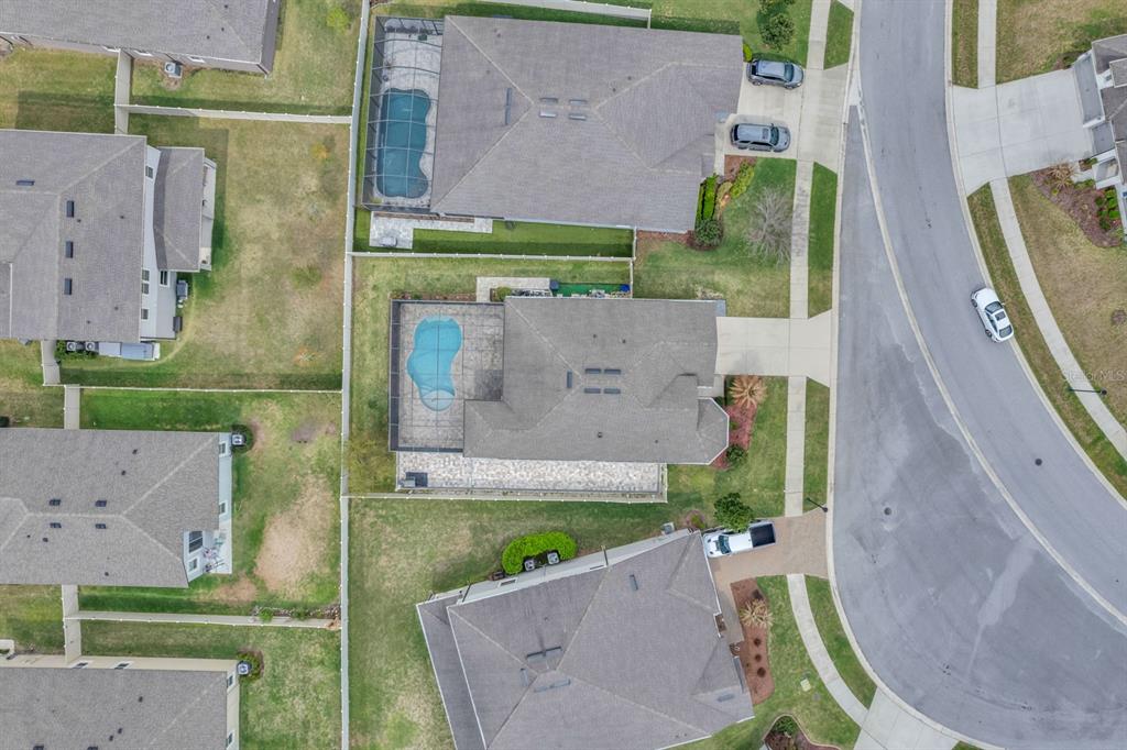 12653 Palapa Loop Spring Hill, FL 34610 - Photo 31 of 33 an aerial view of a house with a garden
