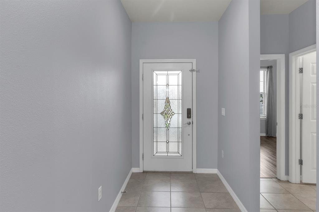 12653 Palapa Loop Spring Hill, FL 34610 - Photo 5 of 33 a view of an empty room with an entryway