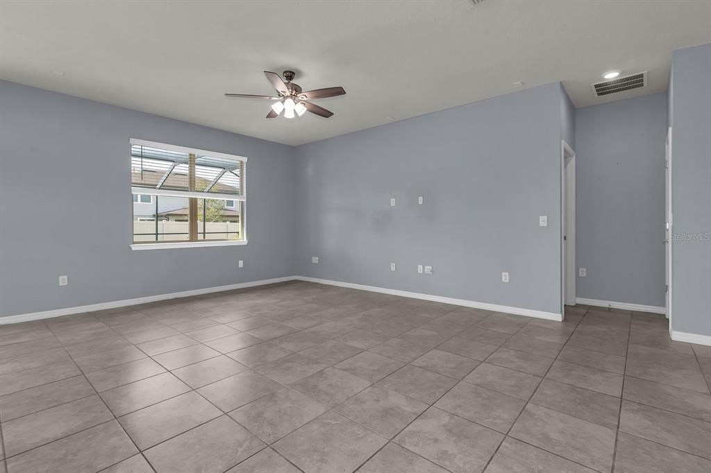 12653 Palapa Loop Spring Hill, FL 34610 - Photo 7 of 33 a view of an empty room with a window
