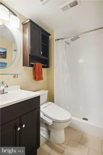 a workspace with furniture and painting on the wall