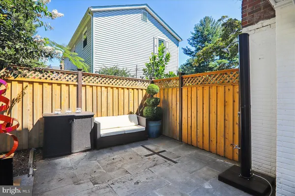a kitchen with stainless steel appliances granite countertop a stove a refrigerator and a cabinets
