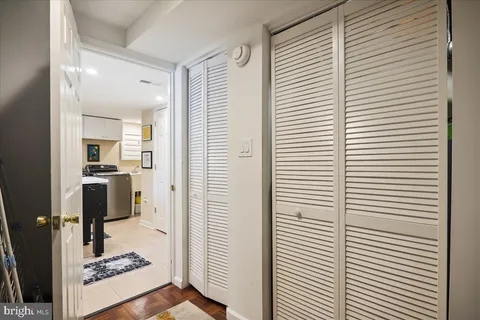 a kitchen with granite countertop a sink and white appliances