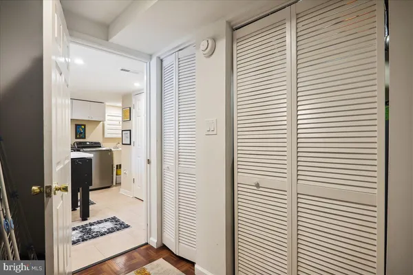a kitchen with granite countertop a sink and white appliances