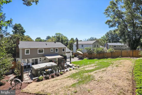 a front view of a house with a yard patio and fire pit
